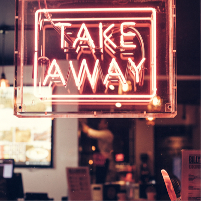 A red neon sign with the words 'Take Away'.
